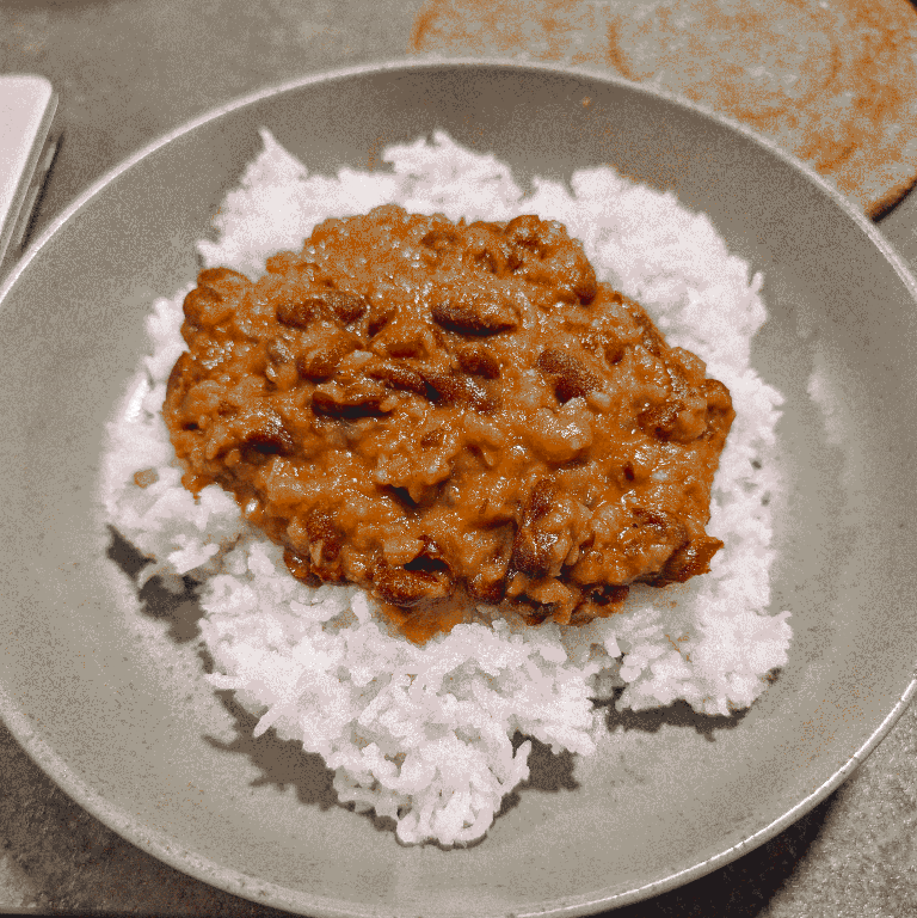 Rajma and rice served on a green plate